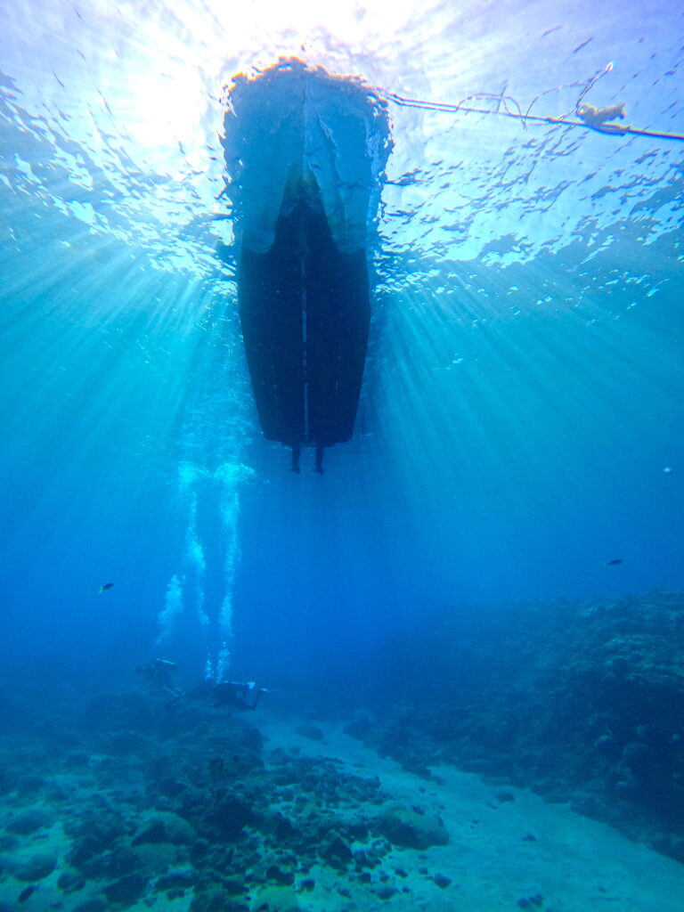MV Teana at Coin De Mire island Mauritius with divers underwater